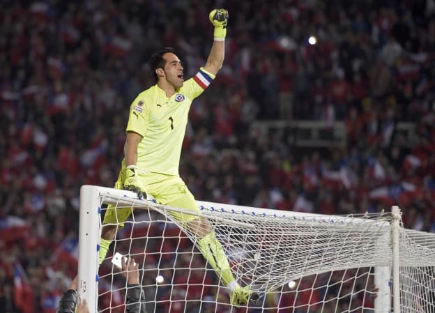 Chile's goalkeeper Claudio Bravo celebrates after winning the 2015 Copa America football championship final against Argentina, in Santiago, Chile, on July 4, 2015. Chile won 4-1 (0-0).  AFP PHOTO / JUAN MABROMATA
