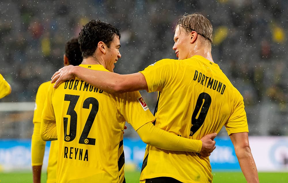 Gio Reyna celebrates with Borussia Dortmund teammate Erling Haaland