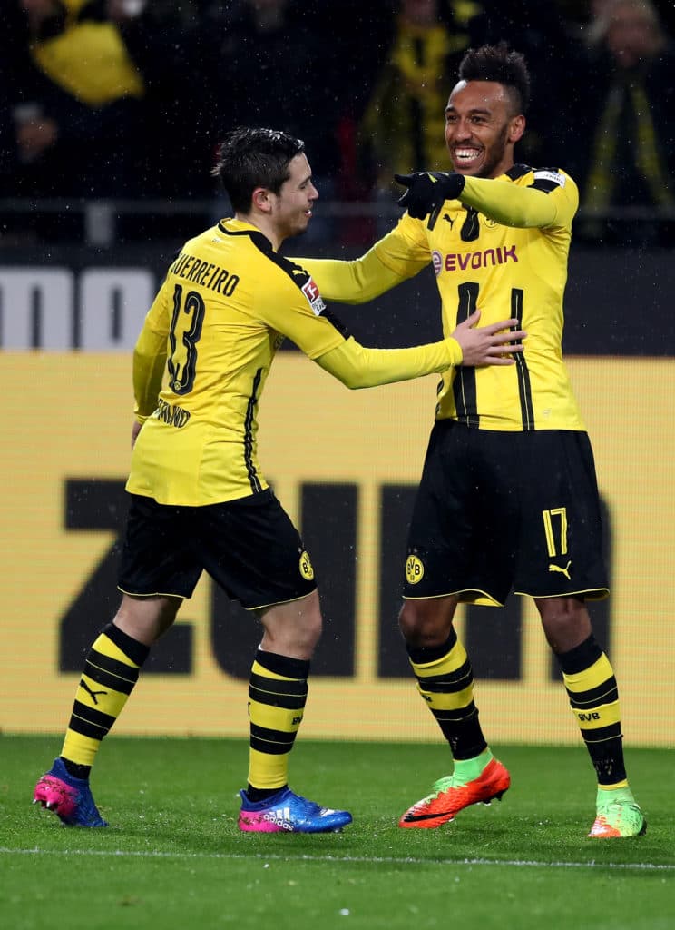 DORTMUND, GERMANY - FEBRUARY 04: Pierre Emerick Aubameyang (R) of Dortmund celebrate with team mate Raphael Guerreiro after he scores the opening goal during the Bundesliga match between Borussia Dortmund and RB Leipzig at Signal Iduna Park on February 4, 2017 in Dortmund, Germany. (Photo by Lars Baron/Bongarts/Getty Images)