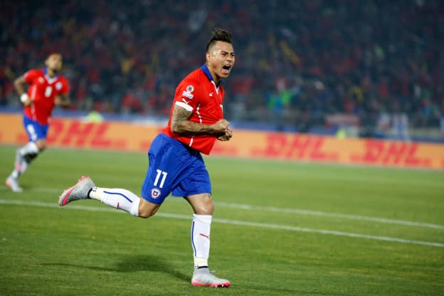 Chile's Eduardo Vargas, right, celebrates after scoring against Peru during a Copa America semifinal soccer match at the National Stadium in Santiago, Chile, Monday, June 29, 2015. (AP Photo/Andre Penner)