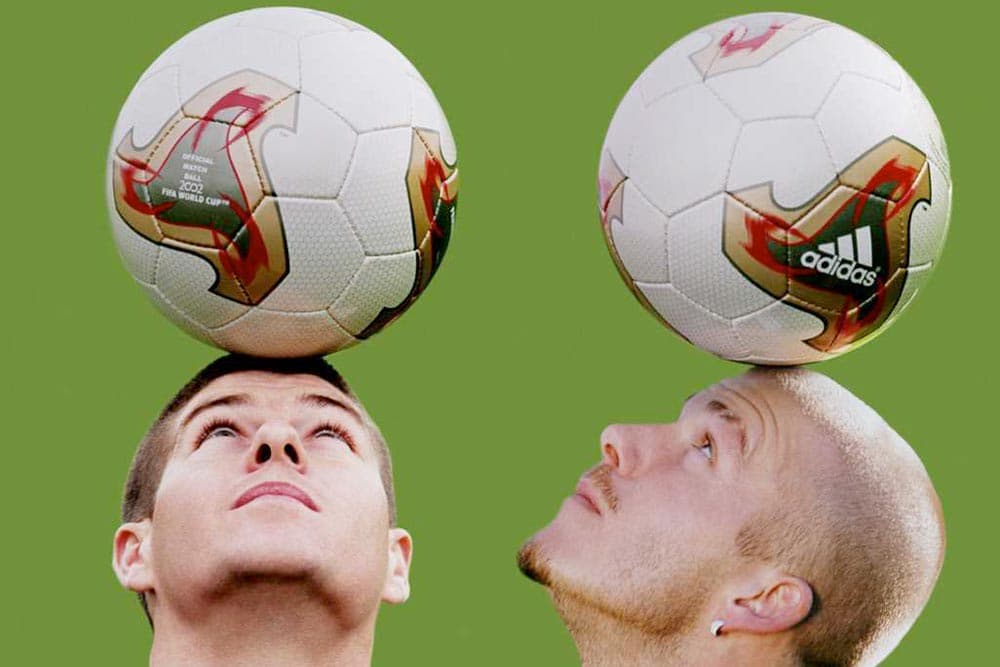 England's Steven Gerrard and David Beckham show off the 2002 adidas Fevernova