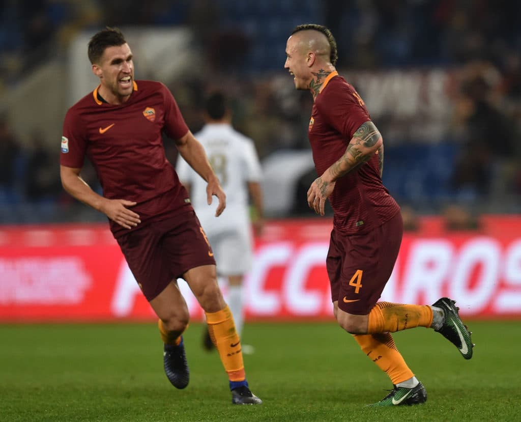 ROME, ITALY - DECEMBER 12: Radja Nainggolan of AS Roma celebrates with Kevin Strootman after scoring the opening goal during the Serie A match between AS Roma and AC Milan at Stadio Olimpico on December 12, 2016 in Rome, Italy. (Photo by Giuseppe Bellini/Getty Images)