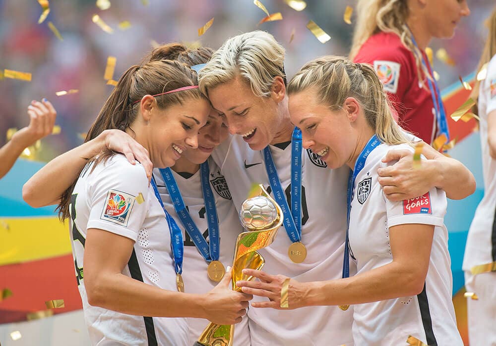 USWNT players with the 2015 FIFA Women's World Cup trophy