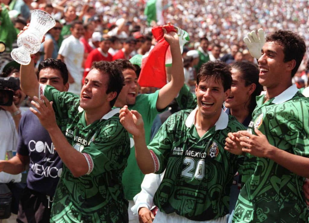PASADENA, : Cuauhtemoc Blanco (L) and others from Mexico's national soccer team celebrate with the trophy after winning the US Cup '96 tournament 16 June in Pasadena, California. Blanco scored the second goal against the United States for a 2-2 score, giving Mexico the tiebreaker. AFP PHOTO/Vince BUCCI (Photo credit should read Vince Bucci/AFP/Getty Images)