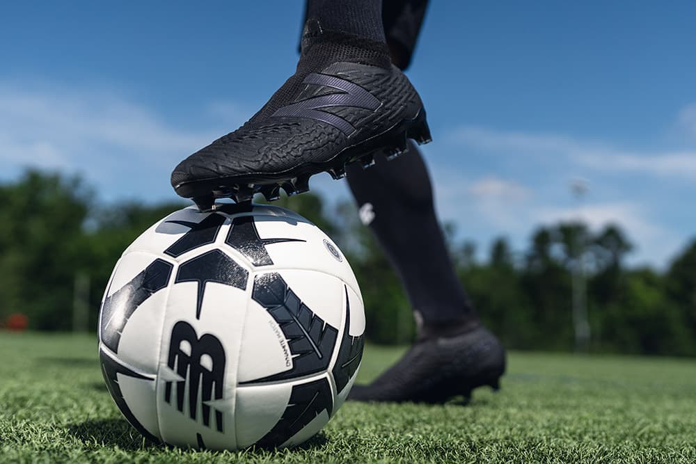 New Balance Tekela v3+ soccer cleats on foot