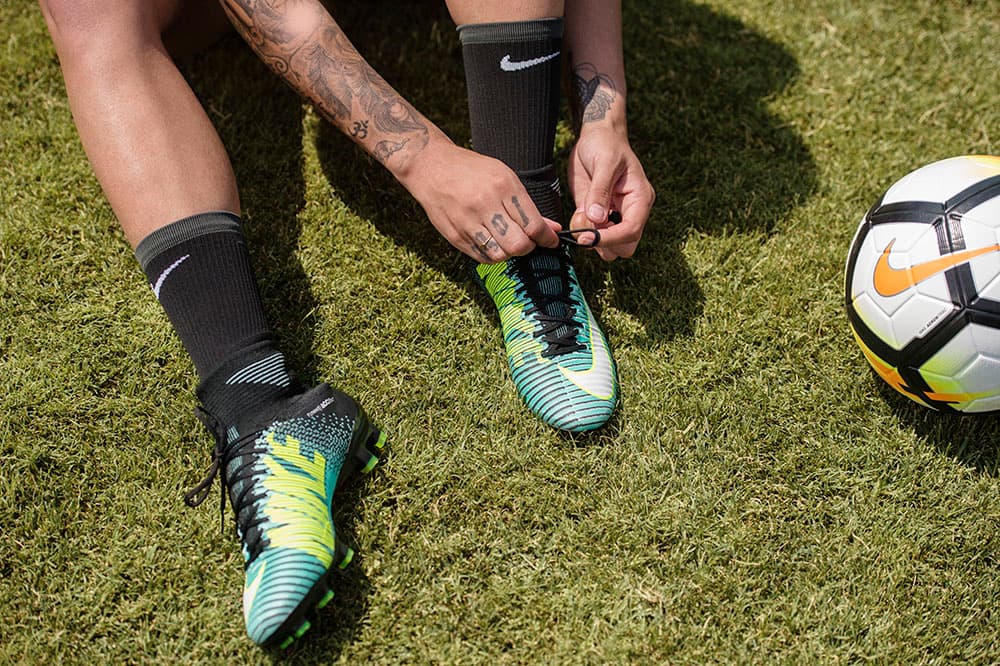 Sydney Leroux laces up her Nike Mercurial cleats
