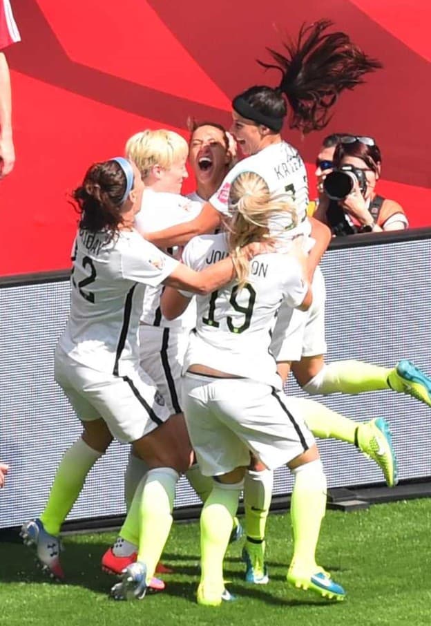 USA players celebrate a goal by the USA's Carli Lloyd (C) during the  2015 FIFA Women's World Cup final between the USA and Japan at BC Place Stadium in Vancouver, British Columbia on July 5, 2015.   AFP PHOTO/NICHOLAS KAMM        (Photo credit should read NICHOLAS KAMM/AFP/Getty Images)