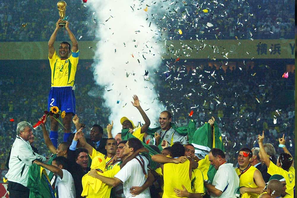 Brazil captain Cafu lifts the 2002 FIFA World Cup trophy.