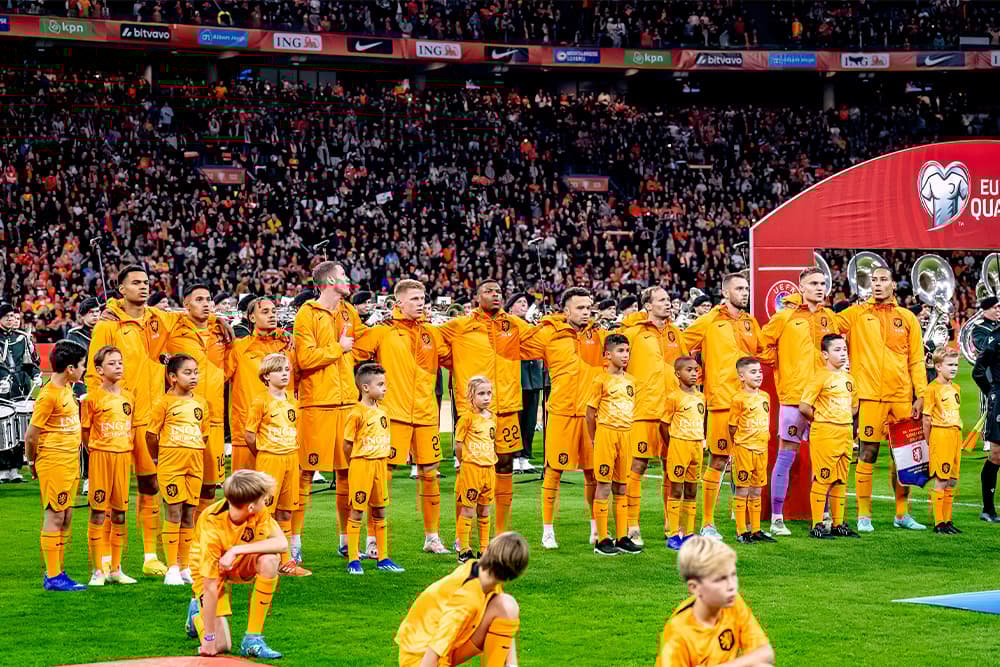 The Dutch national team celebrates on field