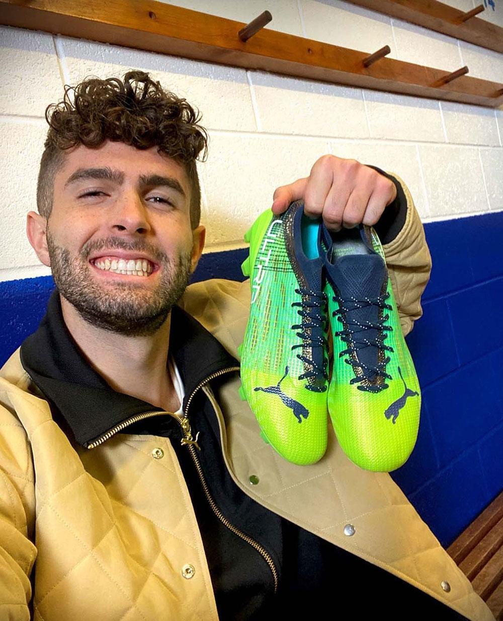 Christian Pulisic with his PUMA Under the Lights Ultra Soccer Cleats
