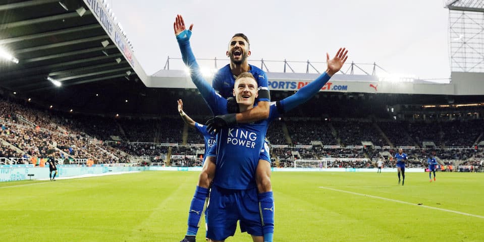 NEWCASTLE, ENGLAND - NOVEMBER 21: Jamie Vardy of Leicester City celebrates with Riyad Mahrez of Leicester City after scoring to equal Ruud Van Nistelrooy's record of scoring in 10 consecutive Premier League matches during the Premier League match between Newcastle United and Leicester City at St. James' Park on November 21, 2015 in Newcastle upon Tyne , United Kingdom. (Photo by Plumb Images/Leicester City FC via Getty Images)