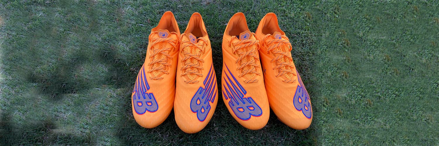 Wide new balance football cleats clearance